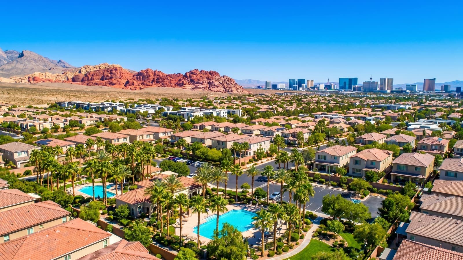 A single-family home in a Las Vegas neighborhood with no HOA, clear desert sky above