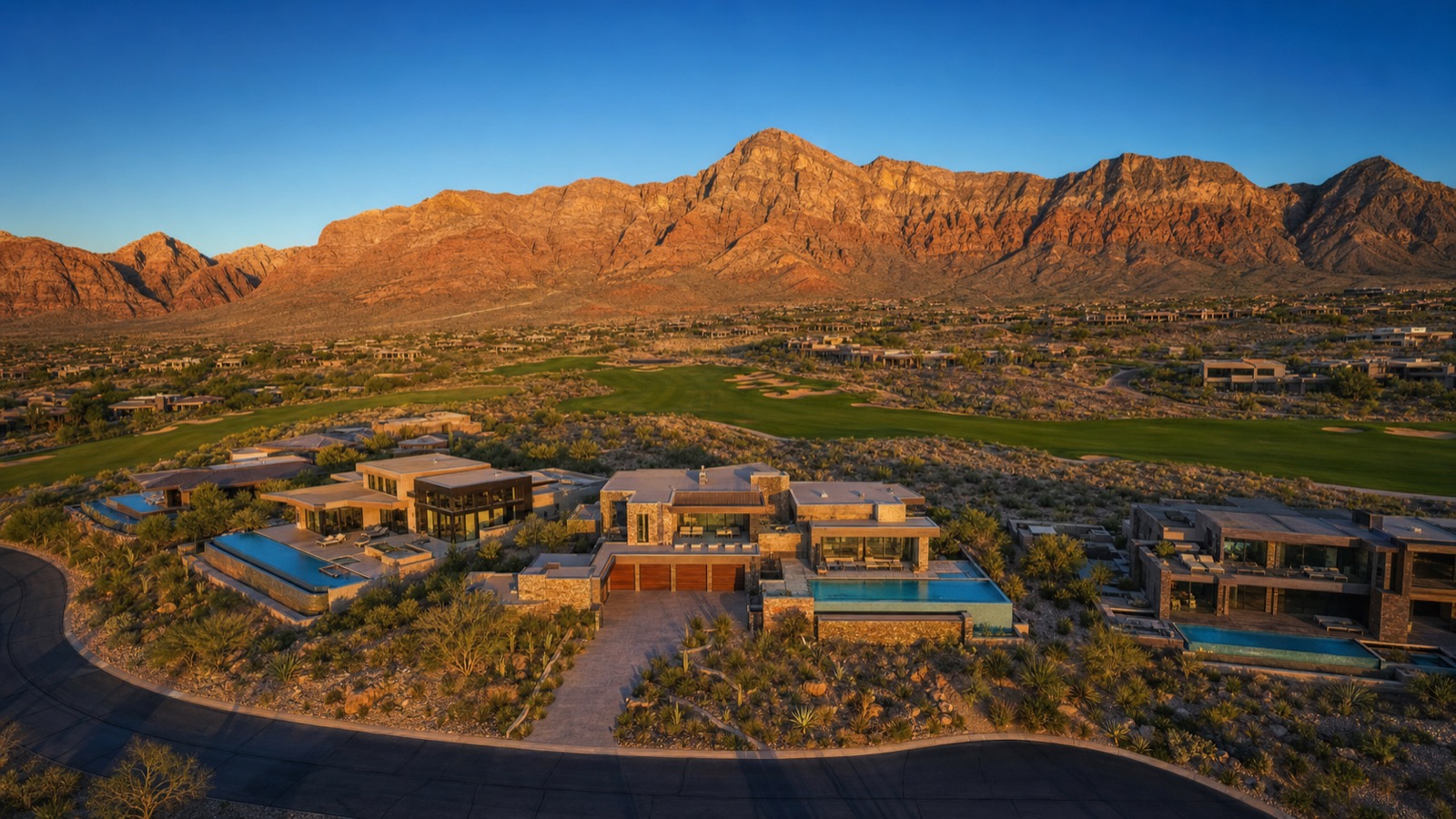 Aerial of a Summerlin golf-course community with manicured fairways and desert backdrop